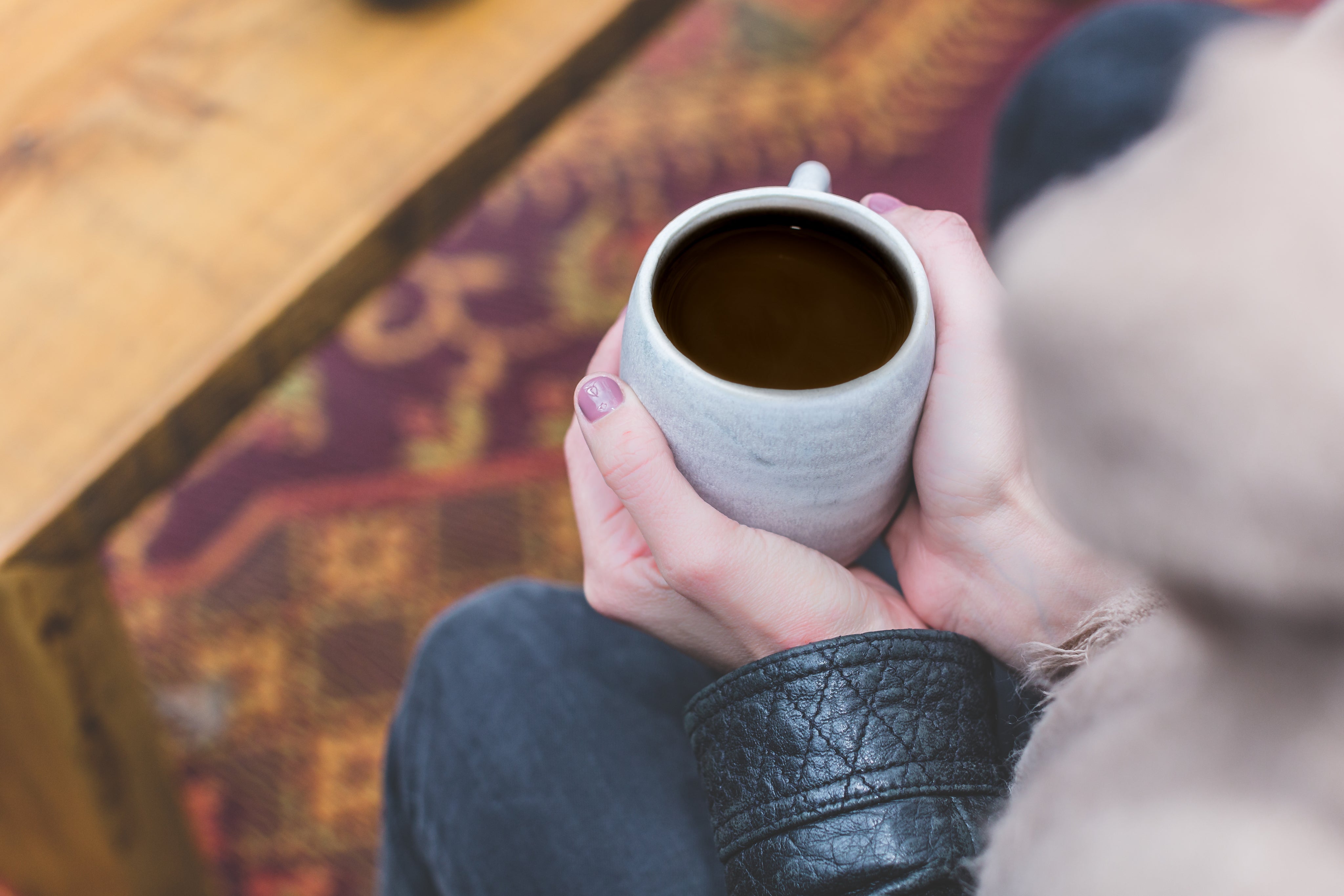 Woman holding a coffee